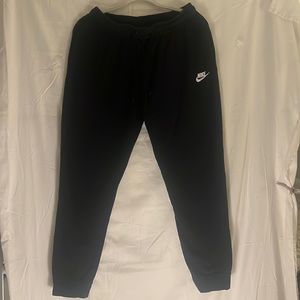 Nike black sweatpants with small white logo.